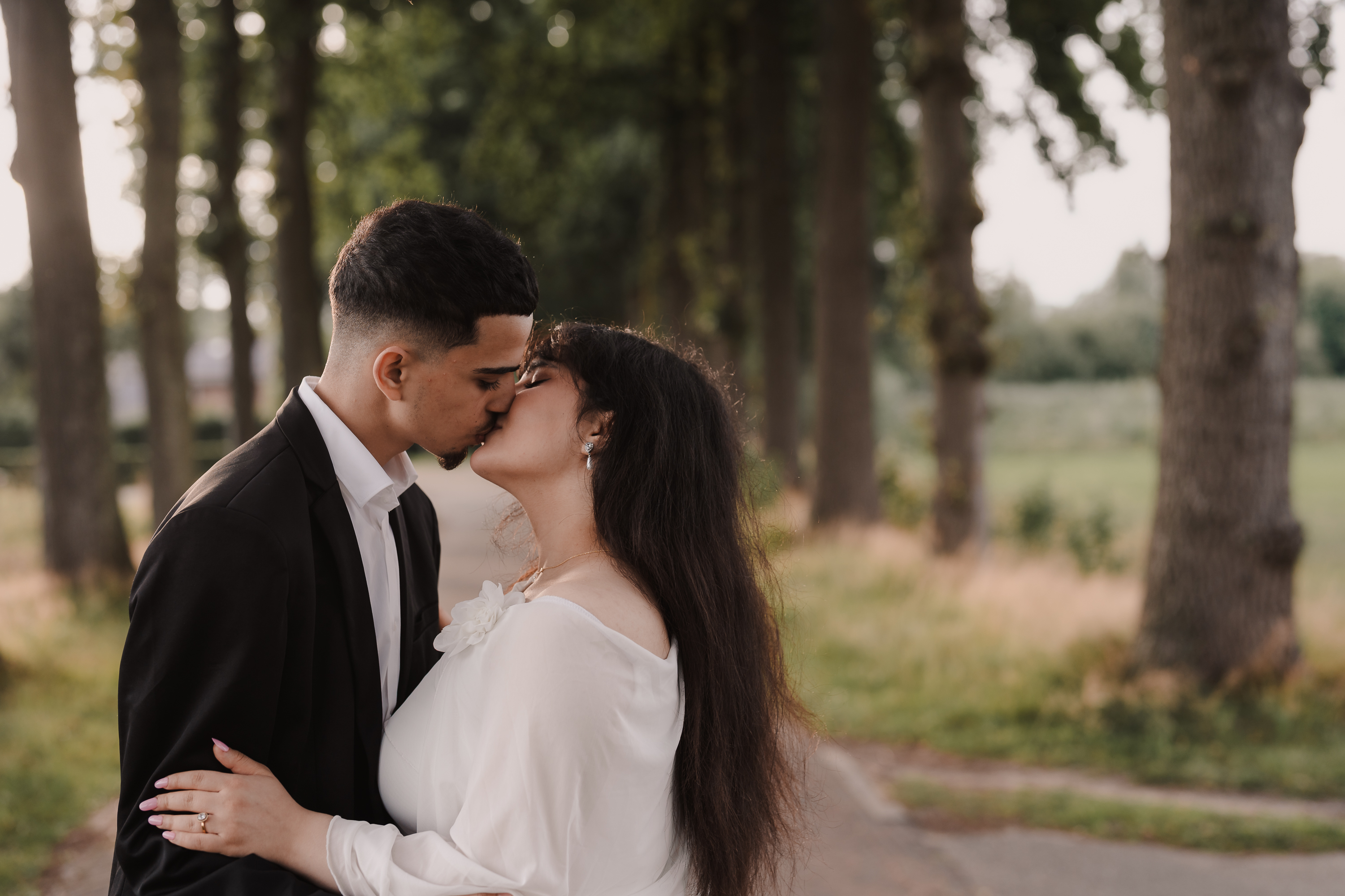 Couple sharing a romantic kiss at sunset in Amersfoort, captured by Photos by Ville, wedding photographer in the Netherlands specializing in international and expat weddings
