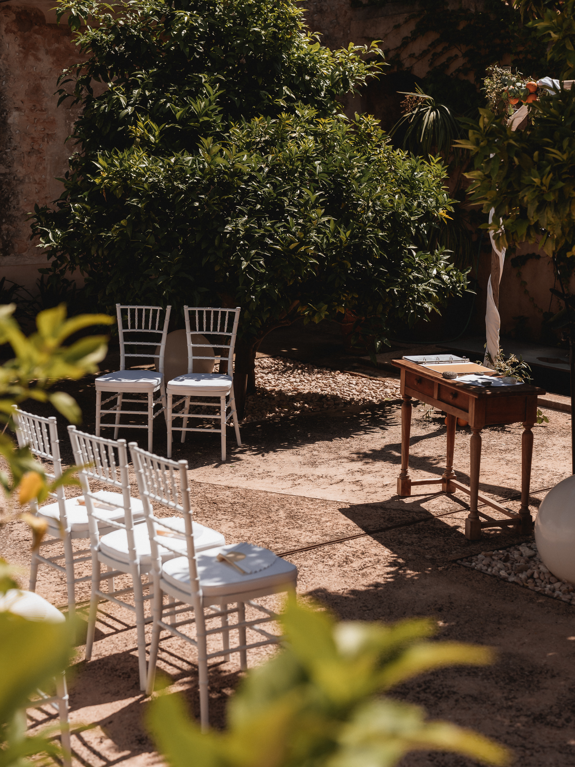 Wedding ceremony setup in the inner courtyard of Finca Son Mir Mallorca with chairs arranged
