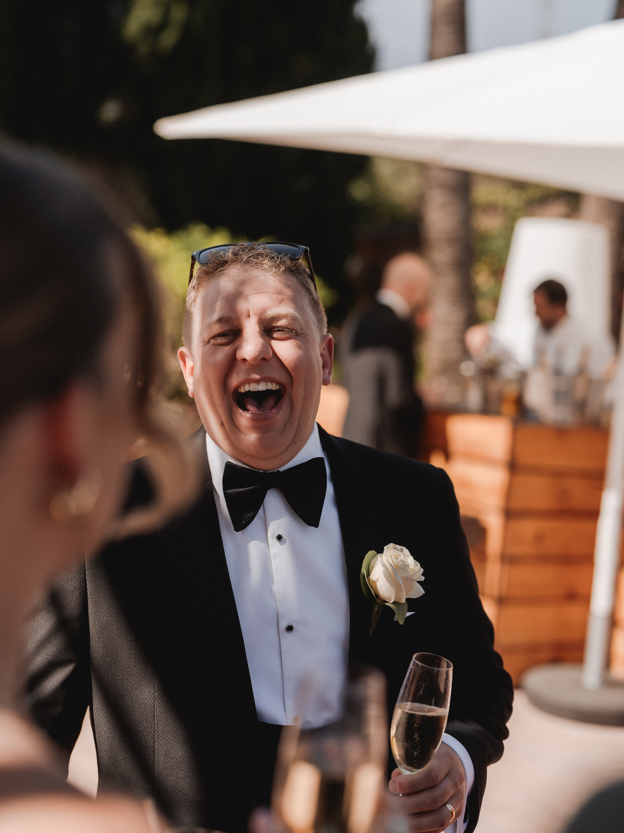 Groom laughing during wedding reception at Finca Son Mir Mallorca captured by Photos by Ville