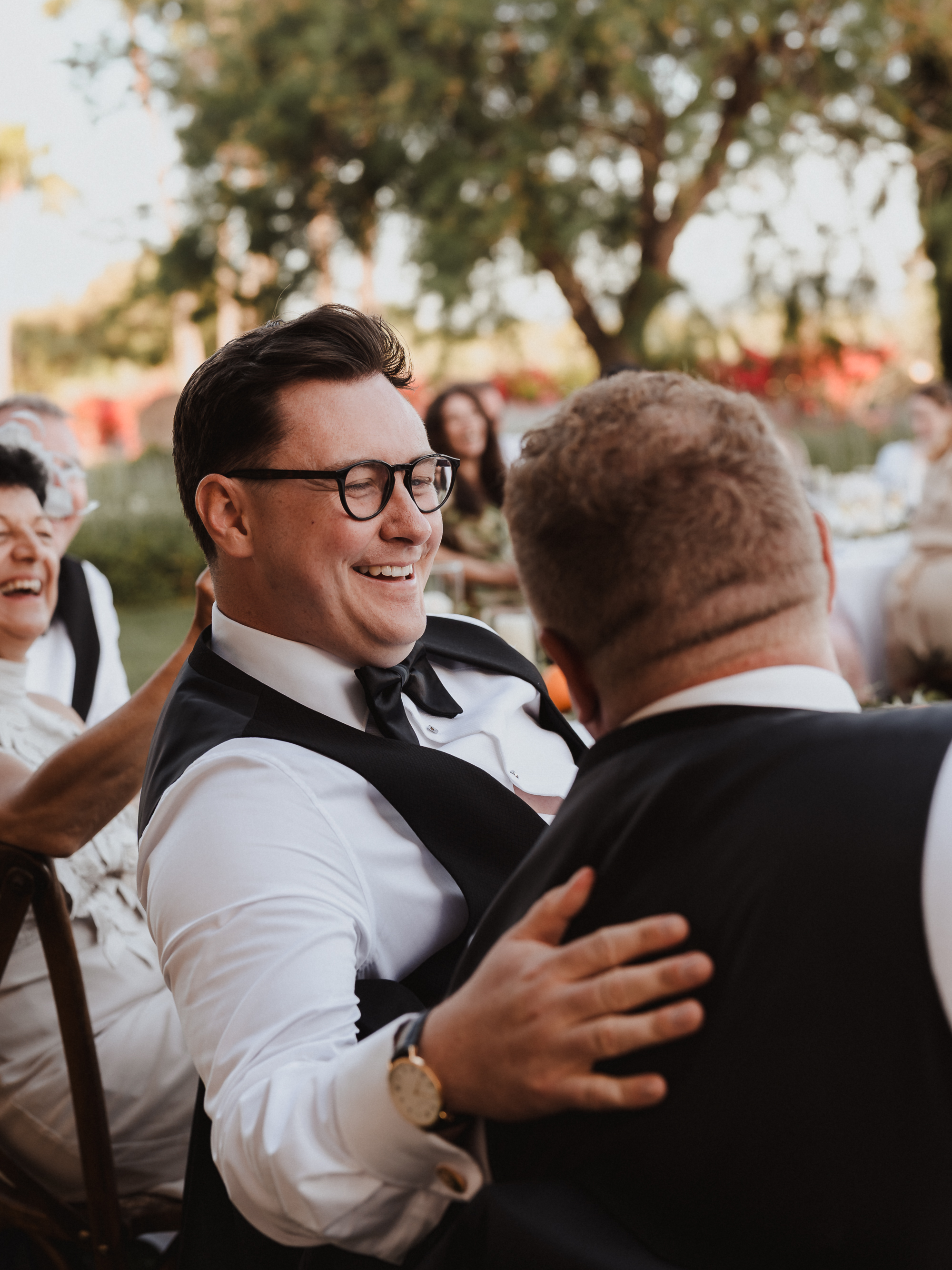 Intimate moment between two grooms during dinner at Finca Son Mir Mallorca captured by Photos by Ville