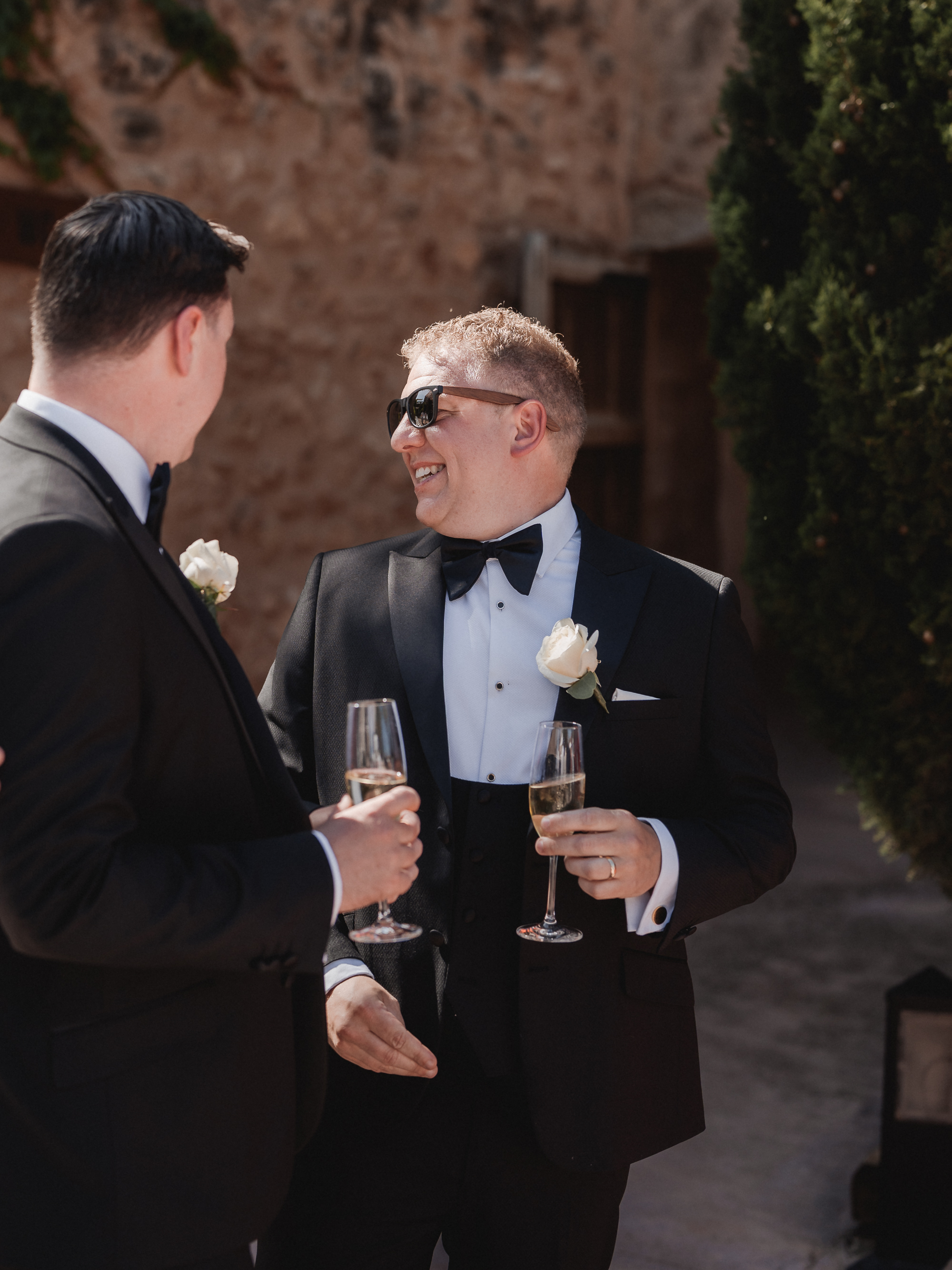Two grooms enjoying their wedding reception at Finca Son Mir Mallorca photographed by Photos by Ville