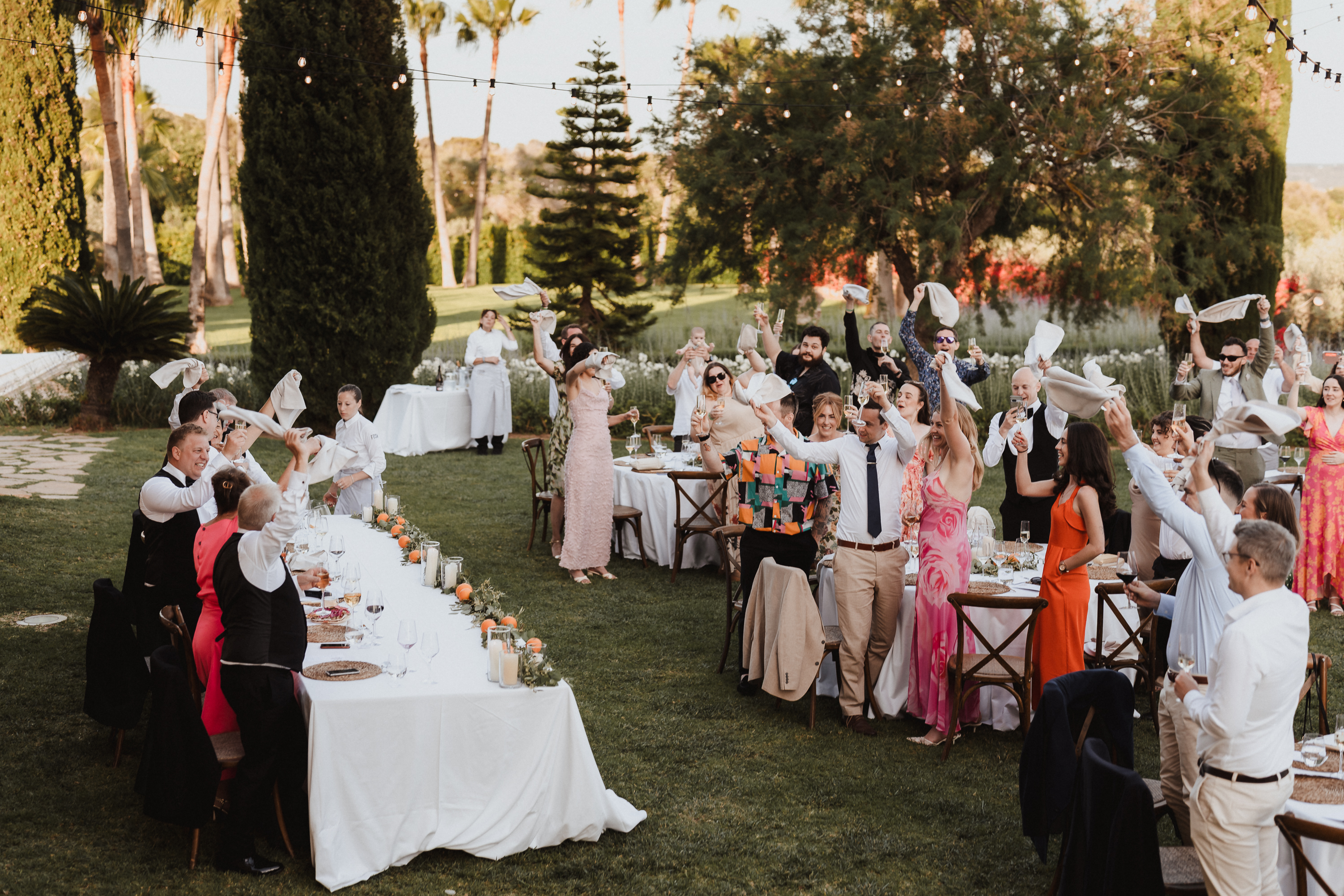 Guests celebrating the wedding couple during dinner at Finca Son Mir Mallorca